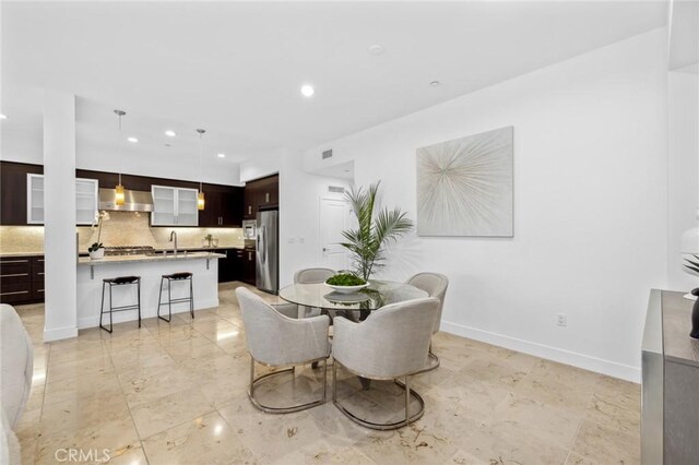 dining area featuring sink