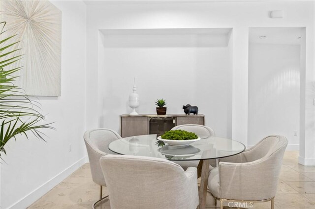 view of tiled dining space