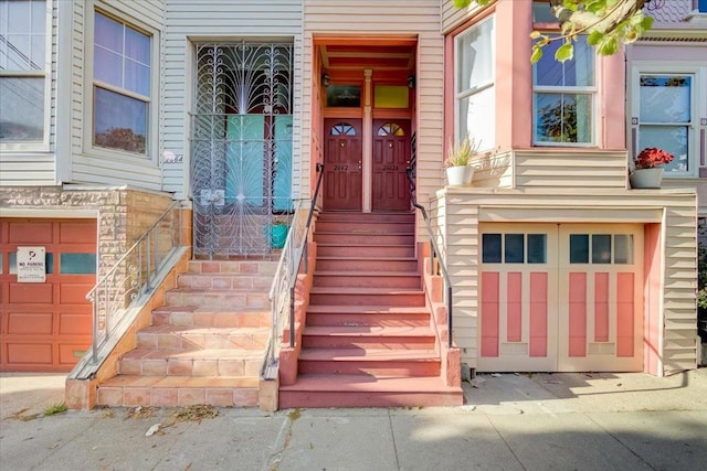 doorway to property featuring a garage