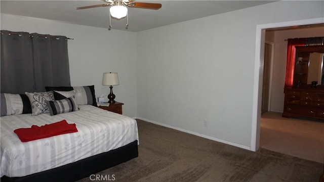 bedroom featuring ceiling fan and dark carpet