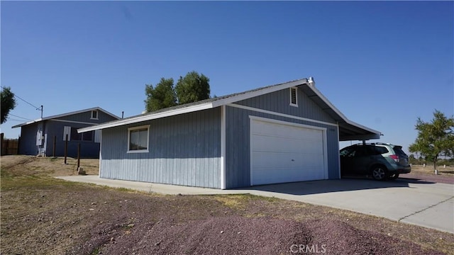 view of side of home with a carport