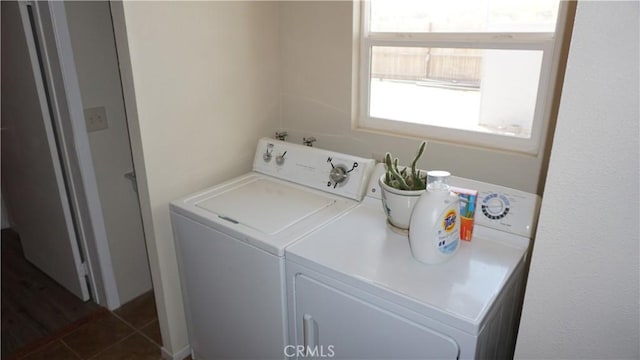 washroom with washing machine and clothes dryer