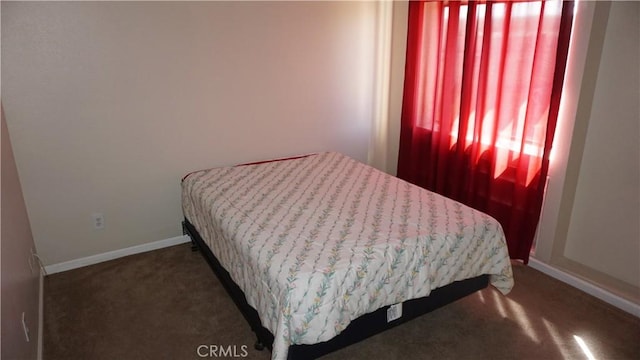 bedroom with dark carpet