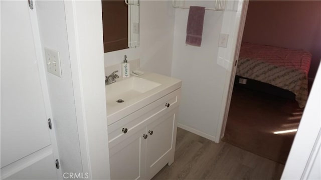 bathroom featuring hardwood / wood-style floors and vanity