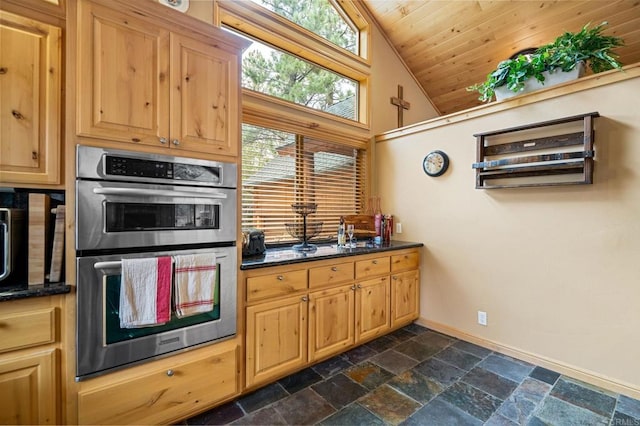 kitchen featuring high vaulted ceiling, dark stone countertops, stainless steel double oven, dark tile patterned flooring, and wood ceiling