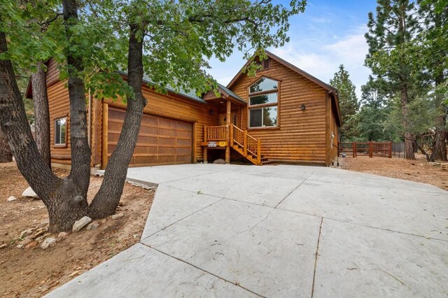 log cabin with a garage