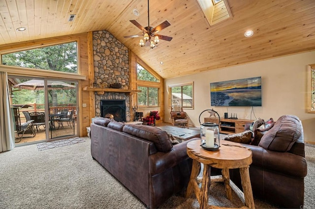 living room with a skylight, light colored carpet, wooden ceiling, a fireplace, and high vaulted ceiling