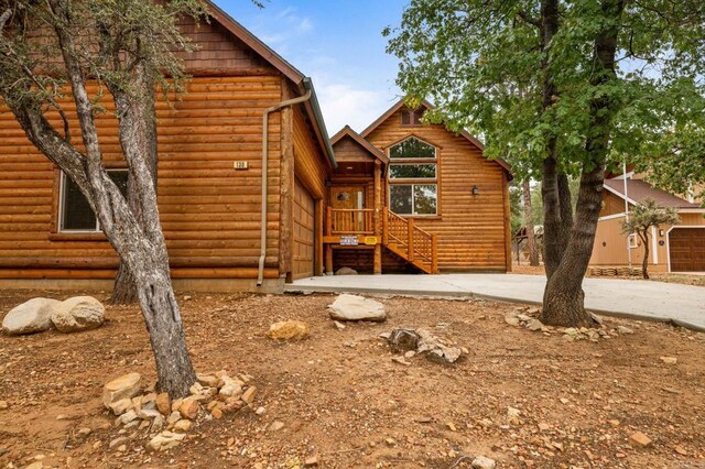 log cabin featuring a garage