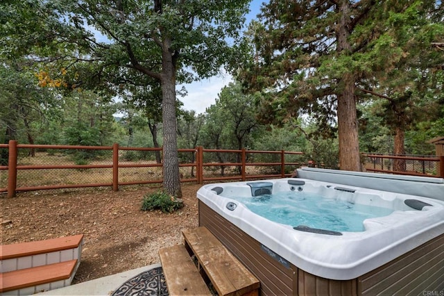 exterior space with a hot tub