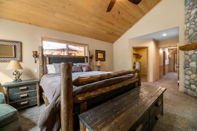 carpeted bedroom featuring a spacious closet, high vaulted ceiling, wooden ceiling, and a closet