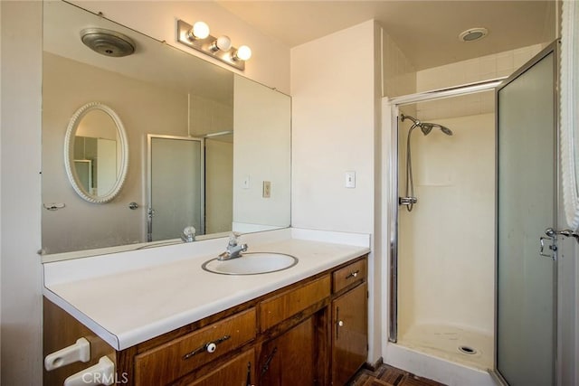 bathroom featuring vanity and a shower with shower door