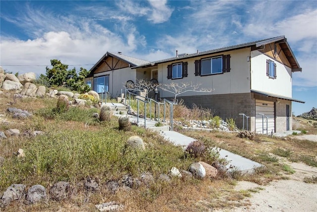 view of front of property with a garage