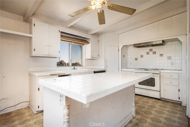 kitchen featuring backsplash, electric range, tile countertops, white cabinets, and a center island