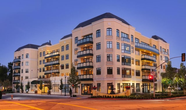 view of outdoor building at dusk