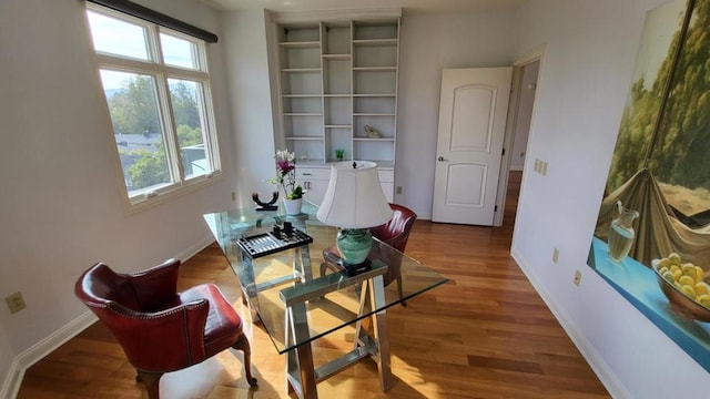 living area with hardwood / wood-style floors