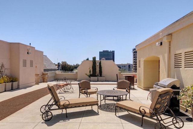 view of patio / terrace with cooling unit and grilling area