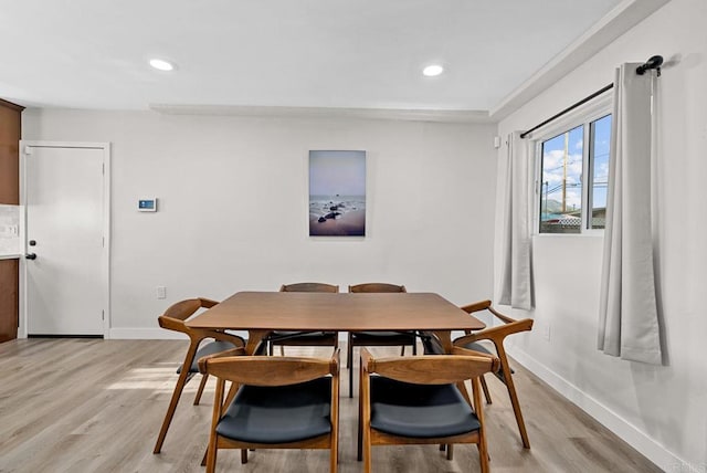 dining area featuring light wood-type flooring