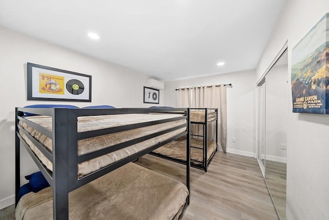 bedroom with a closet and light wood-type flooring