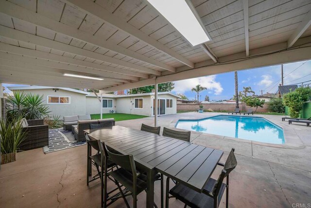 view of swimming pool with an outdoor living space and a patio