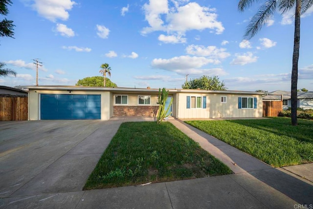 single story home with a front lawn and a garage