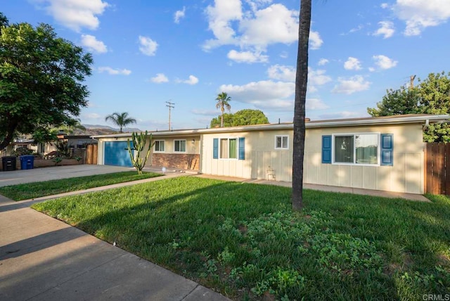 single story home with a front lawn