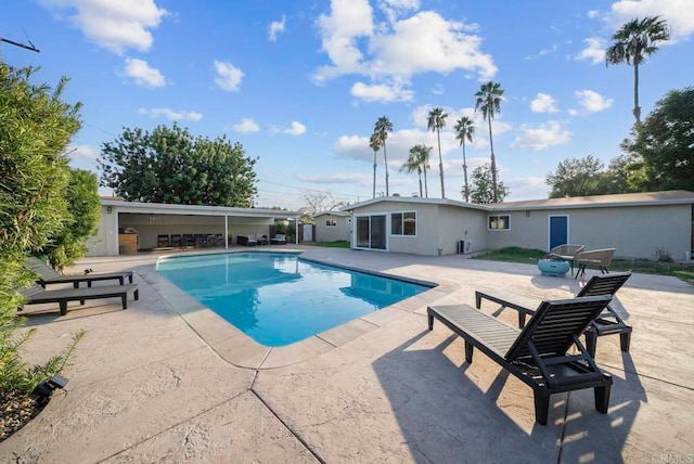 view of swimming pool featuring a patio area