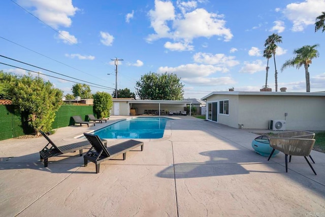 view of swimming pool with a patio and central AC unit