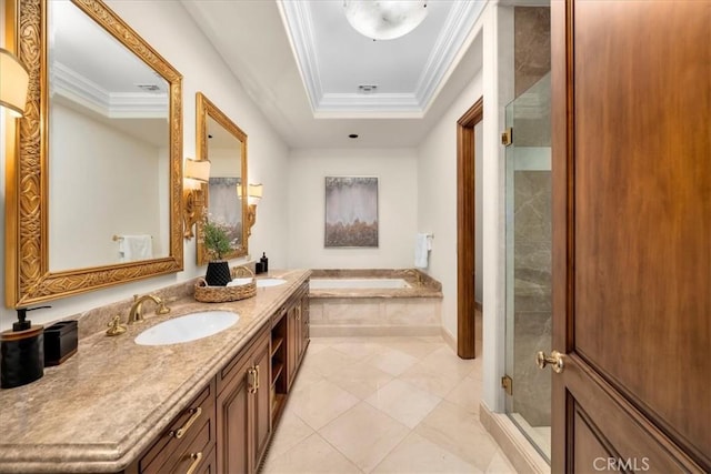 bathroom featuring vanity, a tray ceiling, separate shower and tub, crown molding, and tile patterned flooring