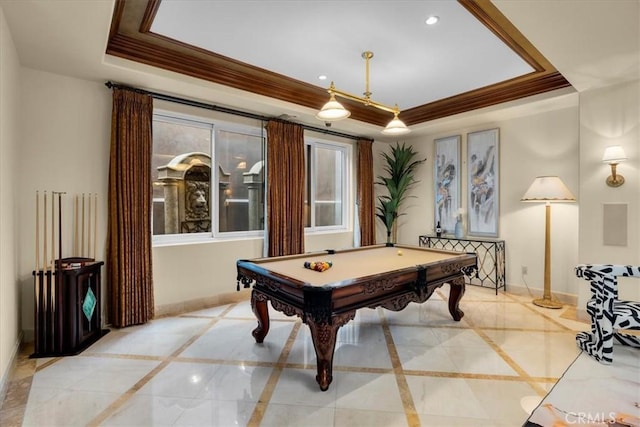 game room featuring a tray ceiling, crown molding, and pool table