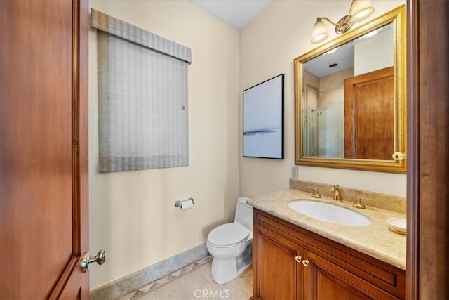 bathroom with toilet, vanity, tile patterned floors, and walk in shower