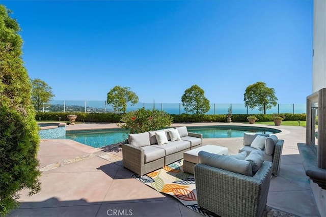 view of swimming pool featuring outdoor lounge area, a water view, an in ground hot tub, and a patio