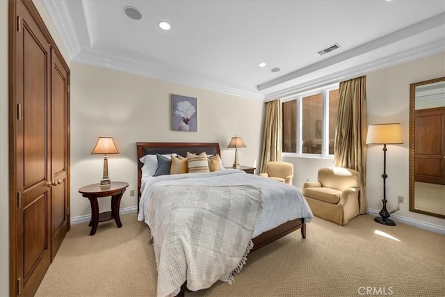 bedroom featuring light colored carpet, ornamental molding, and a closet