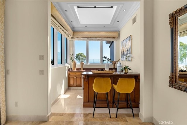 bar featuring a wealth of natural light and ornamental molding