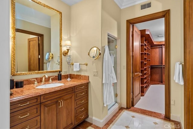 bathroom featuring tile patterned flooring and vanity