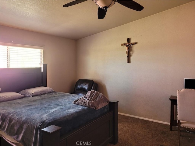 bedroom featuring dark carpet and ceiling fan