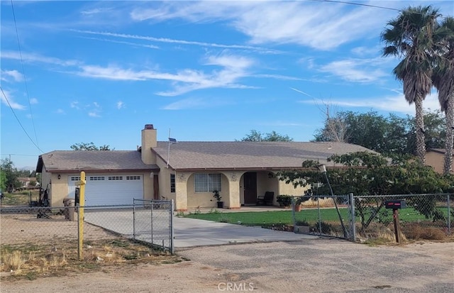 ranch-style home featuring a garage