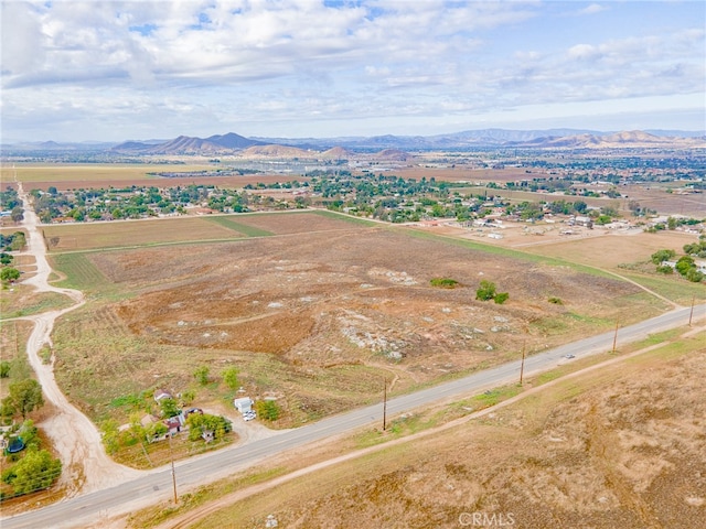 birds eye view of property featuring a mountain view and a rural view