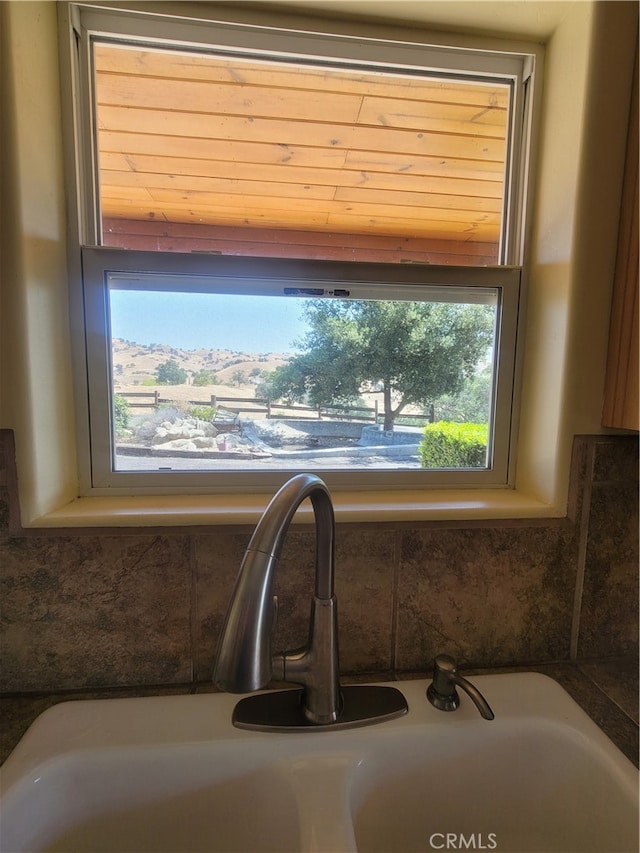 details with sink and a bath to relax in