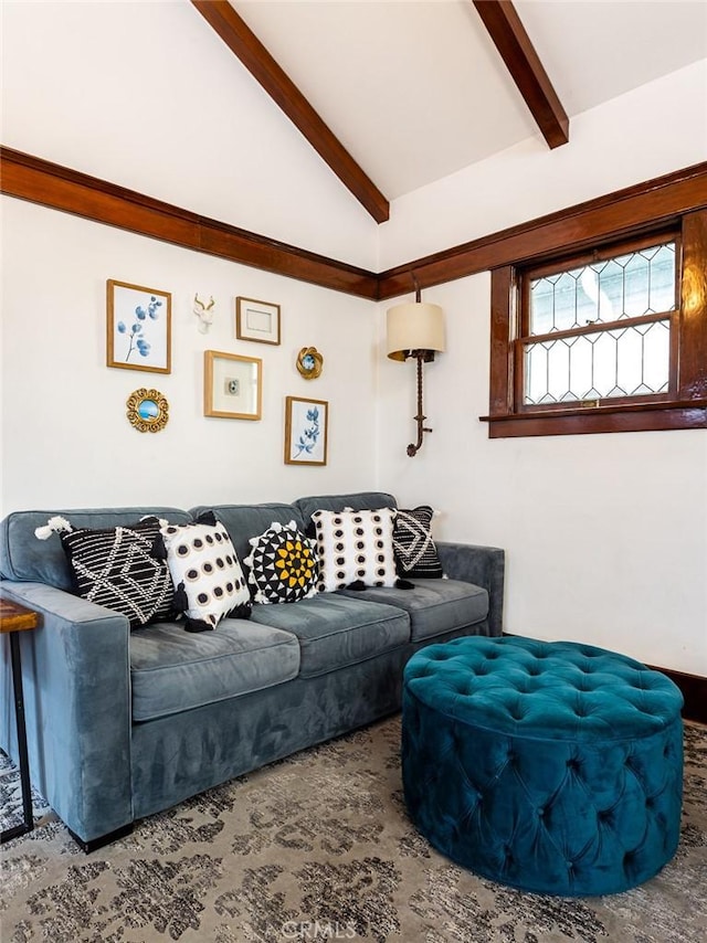 living room with beam ceiling and high vaulted ceiling