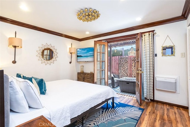 bedroom with dark wood-type flooring, crown molding, and a wall unit AC