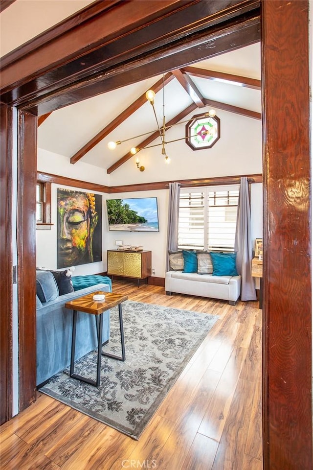 sunroom with lofted ceiling with beams