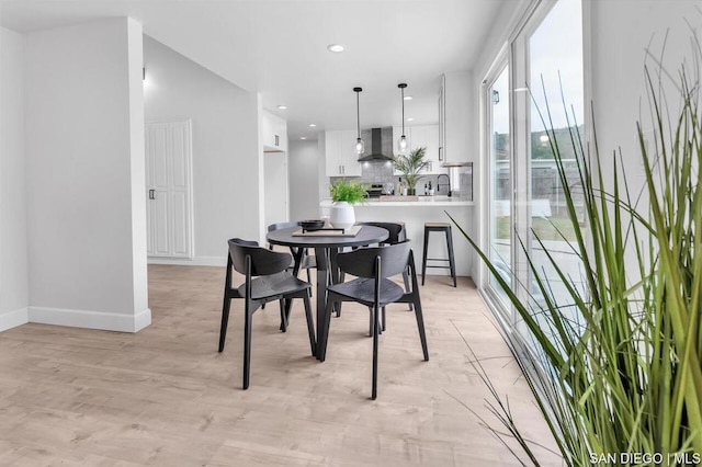 dining room featuring light hardwood / wood-style floors and sink