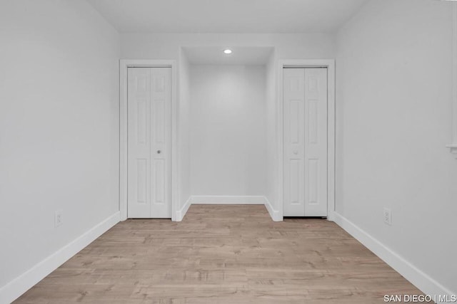 spare room with light hardwood / wood-style floors