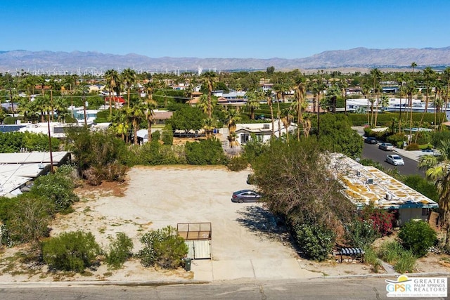 birds eye view of property with a mountain view