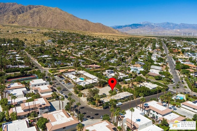 birds eye view of property featuring a mountain view