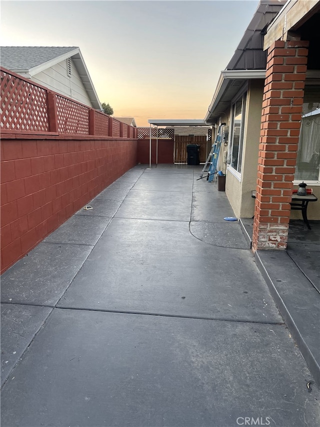 view of patio terrace at dusk