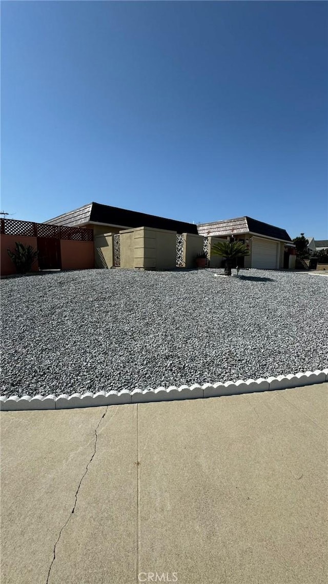 view of property exterior with a garage