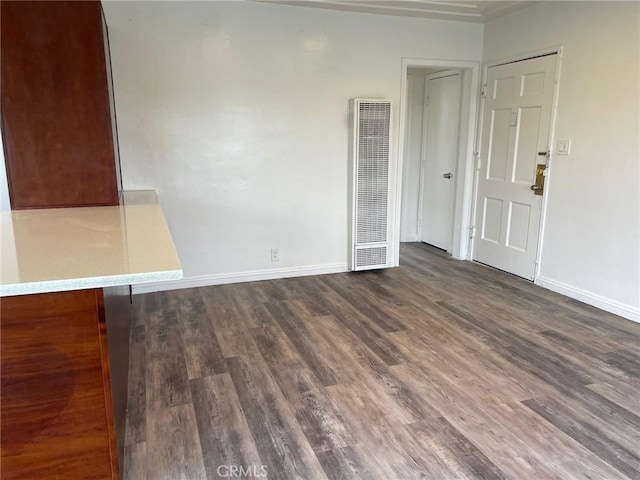 empty room with dark hardwood / wood-style floors