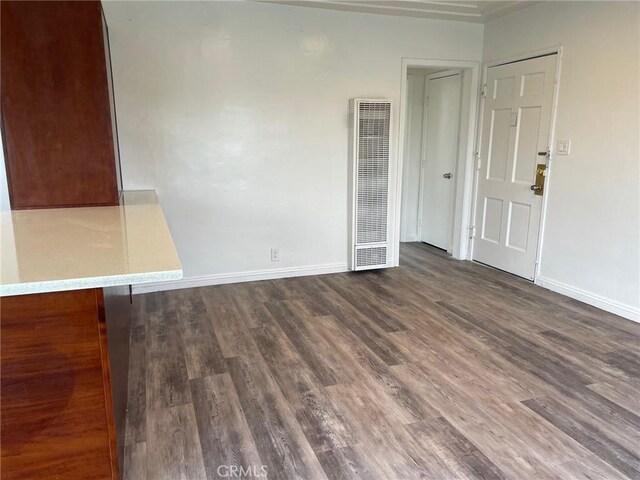 empty room with dark hardwood / wood-style floors