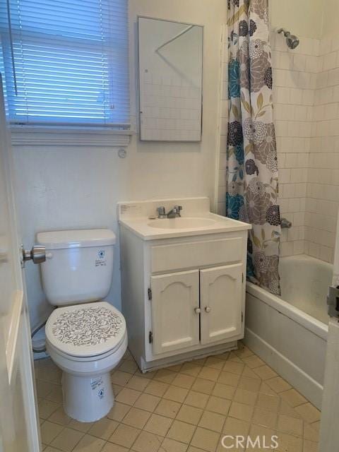 full bathroom featuring tile patterned floors, vanity, toilet, and shower / bathtub combination with curtain